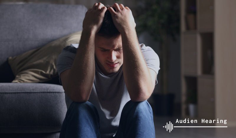 Individual experiencing ringing in the ears from a pinched nerve